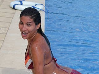 Flirt4Free Caly in pool wearing a wet bikini